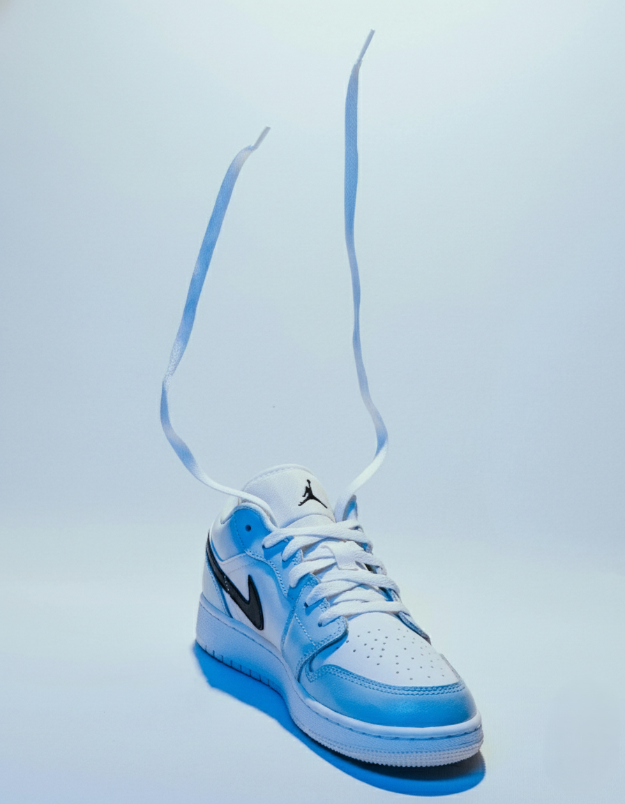 White low-top sneaker with flying laces